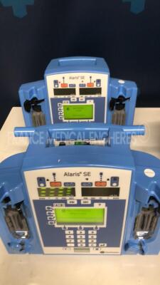 Lot of 5 Carefusion Dual Channel Infusion Pumps Alaris SE 7231 - 2 YOM 2013 - 1 YOM 2007 - 1 YOM 2006 - 1 YOM 2005 - S/W 02.80 - no power cables (All power up) - 4