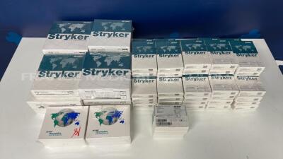 Lot of 50 Stryker Bone Screws 2030-6535-1 and 4 Stryker Bone Screws 40-27022S and 2 Stryker Intramedullaire Plugs 0939 and 4 Stryker Acetabular Cups 0580-6-848 and 2 Stryker Polyethylene Inserts 623-10-32H and 2 Stryker Stabilizer Femorals 5512-F-401 and 