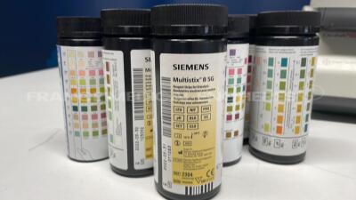 Lot of 4 Siemens Urine Analyzers Clinitek Status - S/W 2.200.007/2.200.007/2.200.007/2.200.007 - w Siemens reagent strips for urinalysis Multistix 8SG - paper roll (All power up) - 8