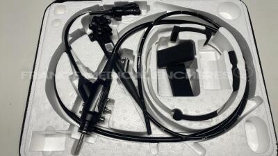 Pentax Gastroscope EG-590WR - Engineer's report : Optical system dots on image ,Angulation no fault found , Insertion tube no fault found , Light transmission no fault found , Channels no fault found, Leak check no fault found - pinch on the connecting t