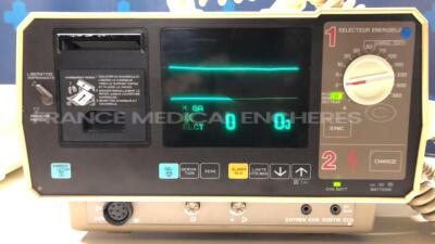 Lot of 1 x Nihon Kohden Defibrillator Cardiolife TEC-7100F and 1 x Hellige Defibrillator Defiport FCP912 (Both power up) - 2