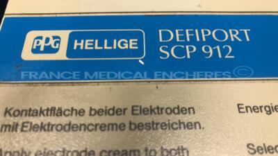 Lot of 1 x Nihon Kohden Defibrillator Cardiolife TEC-7100F and 1 x Hellige Defibrillator Defiport FCP912 (Both power up) - 9