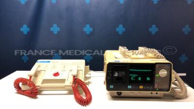 Lot of 1 x Nihon Kohden Defibrillator Cardiolife TEC-7100F and 1 x Hellige Defibrillator Defiport FCP912 (Both power up)