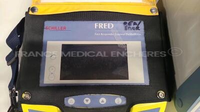 Lot of 1 x Bruker Defibrillator Defigard 3002 IH (No power) and 1 x Schiller Defibrillator FredBI untersted du to the missing battery charger - 5