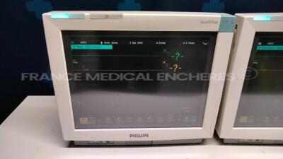 Lot of 2 Philips Patient Monitors MP70 - YOM 2006 - S/W 4.00 - w/ 2 Philips Module M3001A YOM 2014/2015 - Philips Module rack including 2 modules TEMP and 6 modules VueLink ( Both power up) - 2