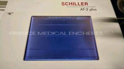 Lot of 1 x Schiller ECG AT-2 Plus with ECG leads and 1 x GE ECG MAC 1200ST with ECG leads - S/W V6.2 - YOM 2008 (Both powers up) - 4