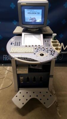 GE Ultrasound Voluson 730 - YOM 11/2005 - S/W 5.4.3 monitor holder to be repaired - Options 4D real time - DICOM - vocal 2 - SRI 2 - VCI - STIC - XTD TD w/ Mitsubishi Printer P93 (Powers up)