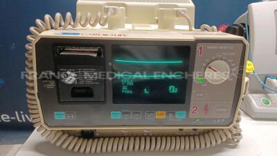 Lot of 1 x Nihon Kohden Defibrillator TEC-7300K and 1 x GE Defibrillator Responder 2000 - YOM 2009 - S/W v2.41 - w/ SPO2 Sensor and 1 x Schiller Defibrillator Defigard 3002IH (All power up) *3201804/40233033/20719* - 2