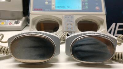 Lot of 1 x Nihon Kohden Defibrillator TEC-7300K and 1 x GE Defibrillator Responder 2000 - YOM 2009 - S/W v2.41 - w/ SPO2 Sensor and 1 x Schiller Defibrillator Defigard 3002IH (All power up) *3201804/40233033/20719* - 9