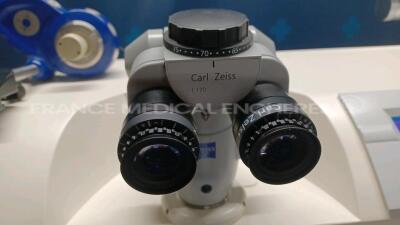 Lot of 1 x Zeiss Excimer Laser MEL 80 1703 - YOM 2005 - S/W 2.0.2 - w/ Zeiss Surgical Microscope - Binoculars 10x/f170 -System monitor needs to be repaired (Powers up) and 1 x Arkus Examination Table LS Comfort 1275-957 - YOM 2004 - w/ Remote control (No - 7