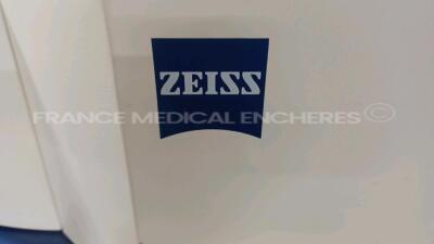 Lot of 1 x Zeiss Excimer Laser MEL 80 1703 - YOM 2005 - S/W 2.0.2 - w/ Zeiss Surgical Microscope - Binoculars 10x/f170 -System monitor needs to be repaired (Powers up) and 1 x Arkus Examination Table LS Comfort 1275-957 - YOM 2004 - w/ Remote control (No - 15