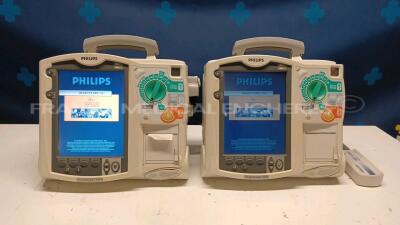 Lot of 2x Philips Defibrillators Heartstart MRX - YOM 2007 and 2010 w/ 1x Philips Test Load M3725A - missing paddles and power cables (Both power up)