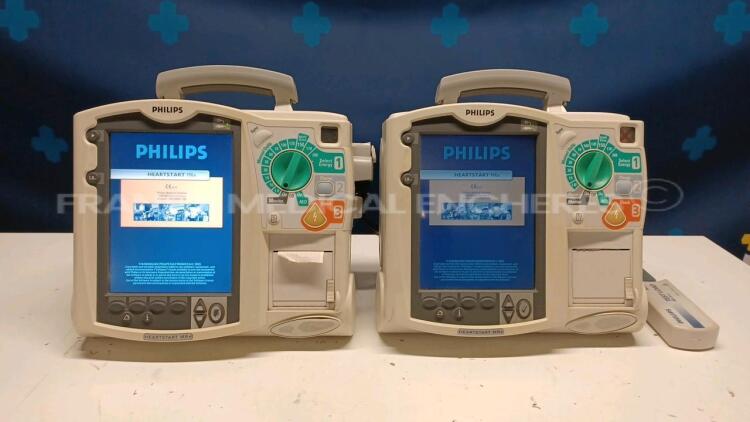 Lot of 2x Philips Defibrillators Heartstart MRX - YOM 2007 and 2010 w/ 1x Philips Test Load M3725A - missing paddles and power cables (Both power up)
