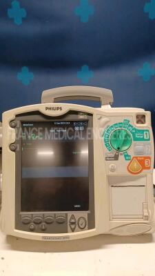 Lot of 2x Philips Defibrillators Heartstart MRX - YOM 2007 and 2010 w/ 1x Philips Test Load M3725A - missing paddles and power cables (Both power up) - 2