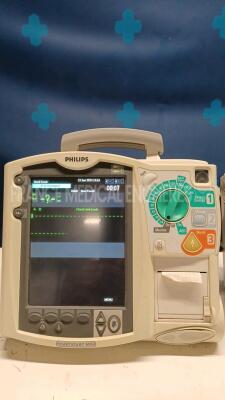 Lot of 2x Philips Defibrillators Heartstart MRX - YOM 2007 and 2010 w/ 1x Philips Test Load M3725A - missing paddles and power cables (Both power up) - 3