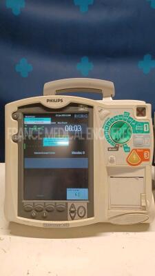 Lot of 2x Philips Defibrillators Heartstart MRX - YOM 2007 w/ 1x Philips Test Load M3725A - missing paddles and power cables (Both power up) - 2