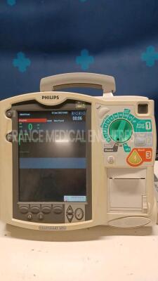 Lot of 2x Philips Defibrillators Heartstart MRX - YOM 2007 w/ 1x Philips Test Load M3725A - missing paddles and power cables (Both power up) - 3
