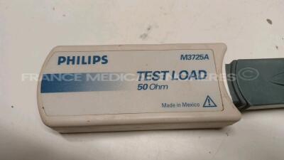 Lot of 2x Philips Defibrillators Heartstart MRX - YOM 2007 w/ 1x Philips Test Load M3725A - missing paddles and power cables (Both power up) - 4