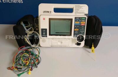 Medtronic Physio-Control Monitor/Defibrillator LIFEPAK 12 - YOM 2003 - S/W 3011371-134 - User Test Passed - Multilingual Device - Light Scratches on Screen (See Photo) - Options - Pacer, CO2, SPO2, PNI, ECG, Auxiliary Power and Printer needs to be repaire