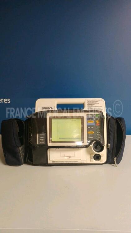 Medtronic Physio-Control Monitor/Defibrillator LIFEPAK 12 - YOM 1998 - S/W 3011371-099- french language (no password to change the language) User Test Passed - Options - , , SPO2, PNI, ECG, - w/ missing Paddles and 1 x Carry Case - No Batteries included (