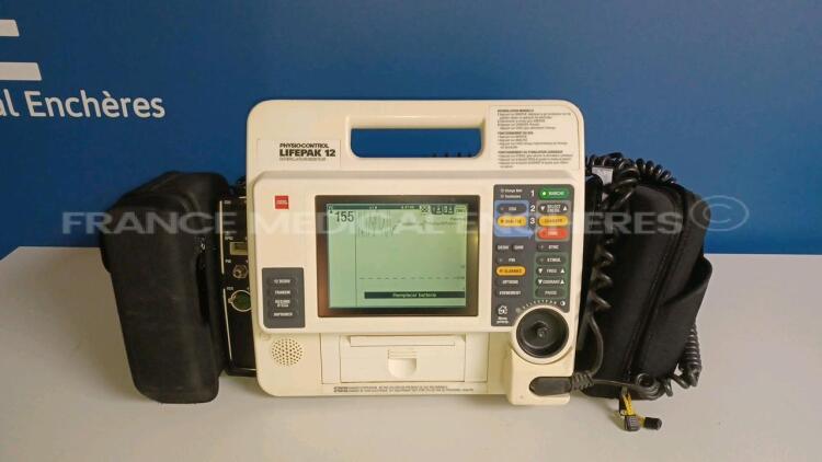 Medtronic Physio-Control Monitor/Defibrillator LIFEPAK 12 - YOM 2000 - S/W 3011371-067 - User Test Passed - Options - Pacer, CO2, SPO2, PNI, ECG, Auxiliary Power and Printer - w/ Paddles and 1 x Carry Case - No Batteries included (Powers up - Damaged - Se