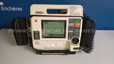 Medtronic Physio-Control Monitor/Defibrillator LIFEPAK 12 - YOM 2000 - S/W 3011371-067 - User Test Passed - Options - Pacer, CO2, SPO2, PNI, ECG, Auxiliary Power and Printer needs to be repaired - w/ Paddles and 1 x Carry Case - No Batteries included (Pow