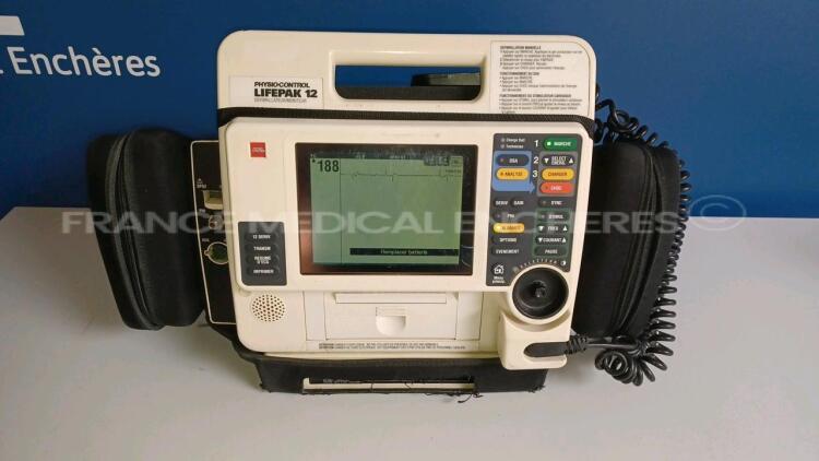 Medtronic Physio-Control Monitor/Defibrillator LIFEPAK 12 - YOM 2000 - S/W 3011371-067 - User Test Passed - Options - Pacer, CO2, SPO2, PNI, ECG, Auxiliary Power and Printer needs to be repaired - w/ Paddles and 1 x Carry Case - No Batteries included (Pow