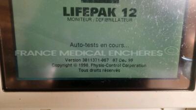 Medtronic Physio-Control Monitor/Defibrillator LIFEPAK 12 - YOM 2000 - S/W 3011371-067 - User Test Passed - Options - Pacer, CO2, SPO2, PNI, ECG, Auxiliary Power and Printer needs to be repaired - w/ Paddles and 1 x Carry Case - No Batteries included (Pow - 4