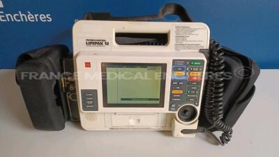 Medtronic Physio-Control Monitor/Defibrillator LIFEPAK 12 - YOM 2000 - S/W 3011371-120 - User Test Passed - Options - Pacer, CO2, SPO2, PNI, ECG, Auxiliary Power and Printer needs to be repaired - w/ Paddles and 1 x Carry Case - No Batteries included (Pow