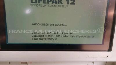 Medtronic Physio-Control Monitor/Defibrillator LIFEPAK 12 - YOM 2000 - S/W 3011371-120 - User Test Passed - Options - Pacer, CO2, SPO2, PNI, ECG, Auxiliary Power and Printer needs to be repaired - w/ Paddles and 1 x Carry Case - No Batteries included (Pow - 3