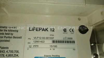 Medtronic Physio-Control Monitor/Defibrillator LIFEPAK 12 - YOM 2000 - S/W 3011371-120 - User Test Passed - Options - Pacer, CO2, SPO2, PNI, ECG, Auxiliary Power and Printer needs to be repaired - w/ Paddles and 1 x Carry Case - No Batteries included (Pow - 8