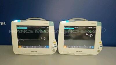 Lot of 2 x Philips Patient Monitors Intellivue Cardiac MP50 - YOM 2010 - S/W K.21.42 - French Language - w/ 2 x Philips Modules M3001A - YOM 2010 (Both powers up - Light Scratches - See Pictures) *DE82078355/DE82078333/DE907V8692/DE907V8697*