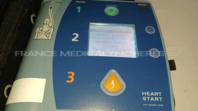 Lot of 2 x Philips Defibrillators Heartstart FR2+ (All power up - French Language - Missing Batteries) *1011890826* - 2