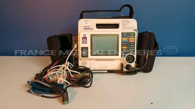 Medtronic/Physio-Control Defibrillator/Monitor Lifepak 12 - YOM 2008 - S/W 3011371-134 - User Test Passed - Multilingual Device - Missing Paddles - w/ 1 x ECG Leads and 1 x SPO2 Sensors and 1 x Cuff (Powers up - Slight Scratches - Batteries not included -