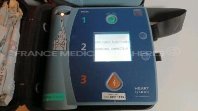 Lot of 3 x Philips Defibrillators Heartstart FR2+ w/ 3 x Philips Batteries (All power up - French Language) *1011890819/1011890814/1011890706* - 2