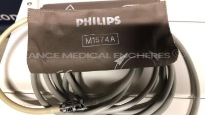 Lot of Philips Fetal Monitor Series 50 XM - YOM 2004 w/ Philips Base Station for Transducer Fetal Monitor Avalon CTS - YOM 02/2013 and Transducer US and Transducer TOCO and ECG Sensor and Philips Adult Cuff (Both power up) - 9