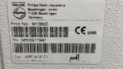 Lot of Philips Fetal Monitor Series 50 XM - YOM 2004 w/ Philips Base Station for Transducer Fetal Monitor Avalon CTS - YOM 02/2013 and Transducer US and Transducer TOCO and ECG Sensor and Philips Adult Cuff (Both power up) - 12