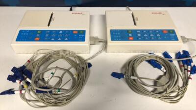 Lot of 2 Schiller ECG Cardiovit AT-1 w/ ECG Sensors (Both power up)